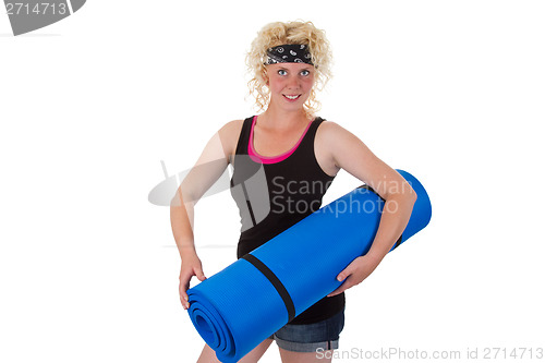 Image of Woman with gymnastic mat