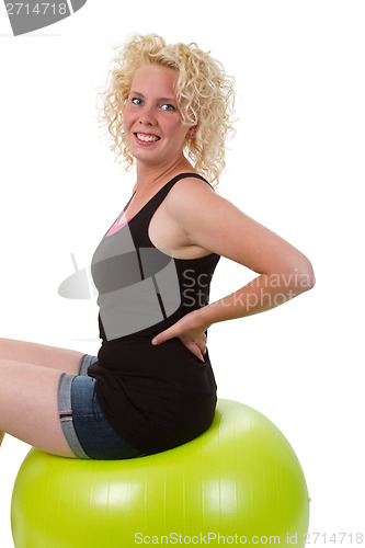 Image of Young woman stretching