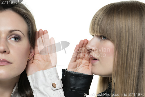 Image of Two woman whisper