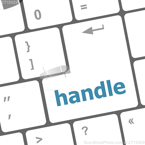 Image of computer keyboard with words handle on enter button