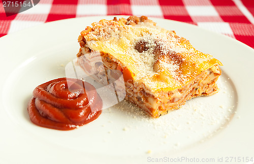 Image of Portion of tasty lasagna on a plate 