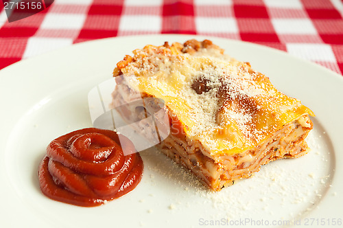 Image of Portion of tasty lasagna on a plate 