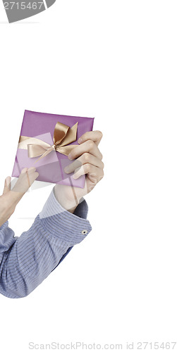 Image of Young man holding a present