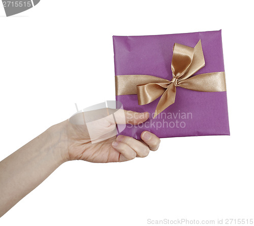 Image of Young woman holding a present