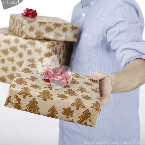 Image of Young man holding a present