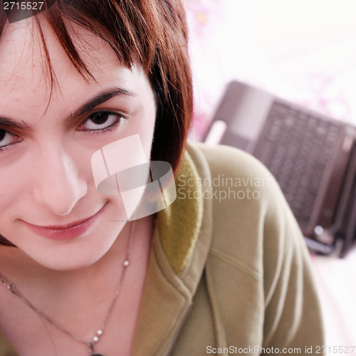 Image of Young woman in bed