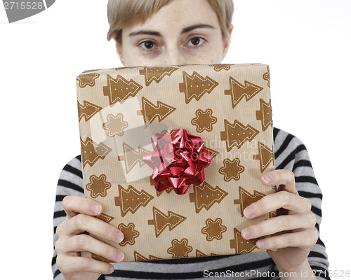 Image of Young woman holding a present