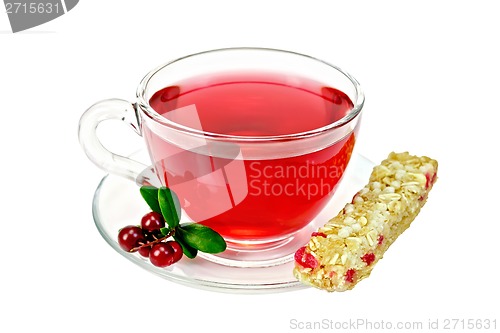 Image of Tea with cowberry in glass cup and granola