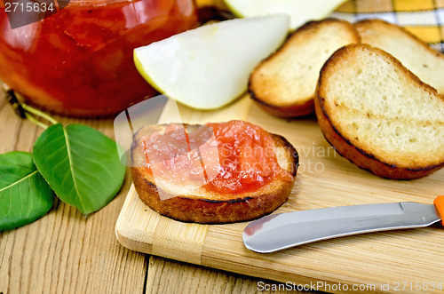 Image of Bread with pear jam on a board