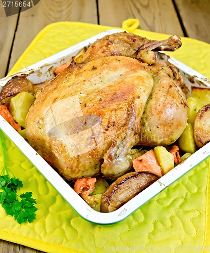 Image of Chicken baked with vegetables in tray and parsley