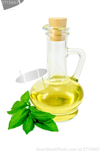 Image of Vegetable oil in a carafe with basil