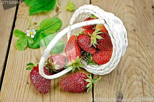 Image of Strawberry poured out of basket on board