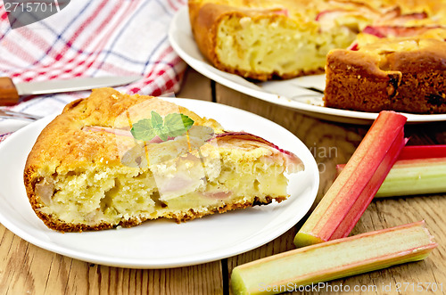 Image of Pie with rhubarb and a knife on board