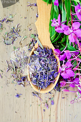 Image of Herbal tea of fireweed on wooden spoon