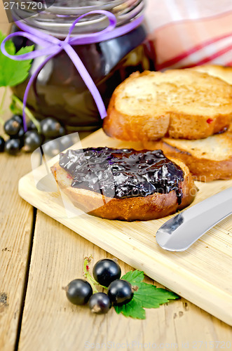 Image of Bread with black currant jam on the board