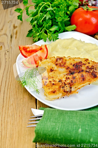 Image of Fish fried with mashed potatoes and tomatoes