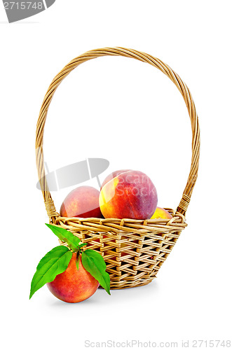Image of Peaches with leaves and basket