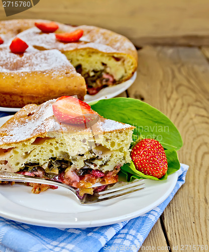 Image of Pie with strawberry and sorrel on boards
