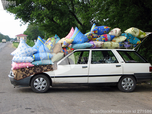 Image of Cars loaded coloured bag on the sidelines. funny picture