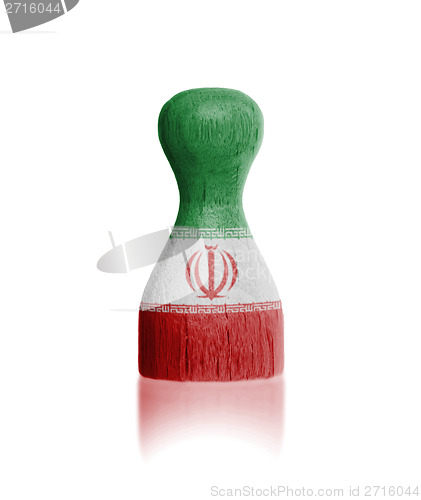 Image of Wooden pawn with a flag painting