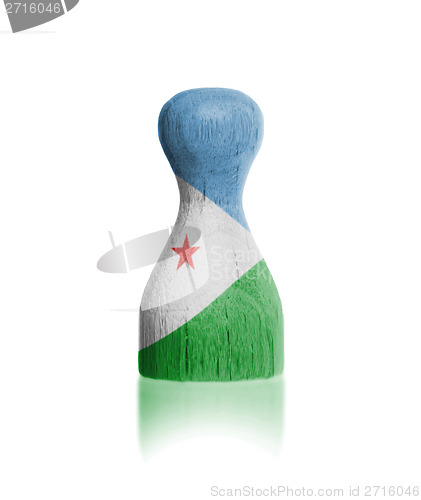 Image of Wooden pawn with a flag painting