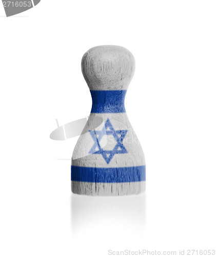 Image of Wooden pawn with a flag painting