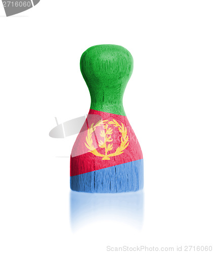 Image of Wooden pawn with a painting of a flag