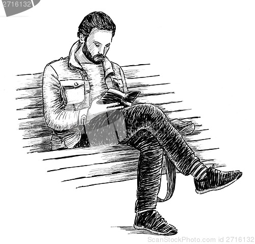 Image of man reading a book