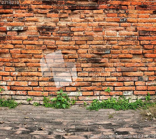 Image of Old brick wall and sidewalk