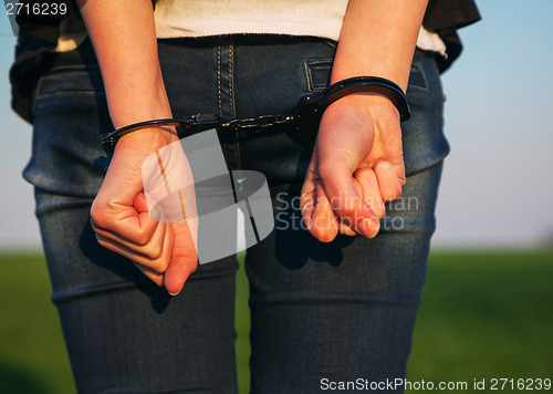 Image of Woman with handcuffed hands