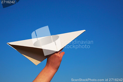 Image of Hand holding paper plane