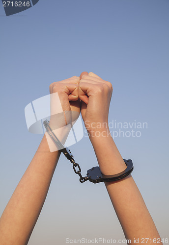 Image of Handcuffed woman hands