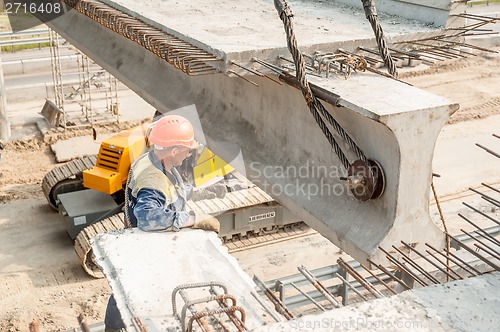 Image of Workers mount bridge span