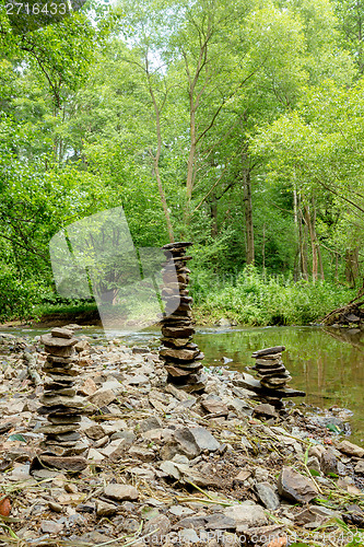 Image of Stones pyramid near small river