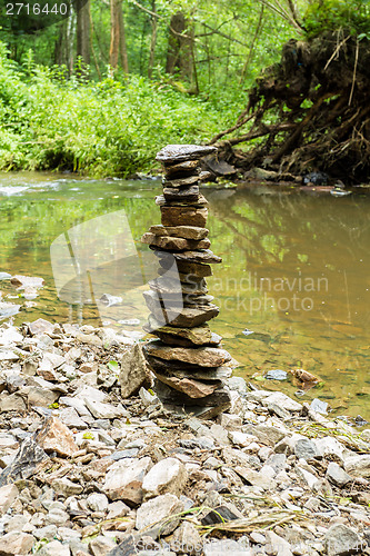 Image of Stones pyramid near small river