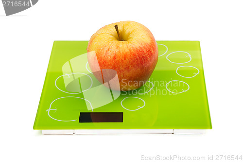 Image of Red apple on scales