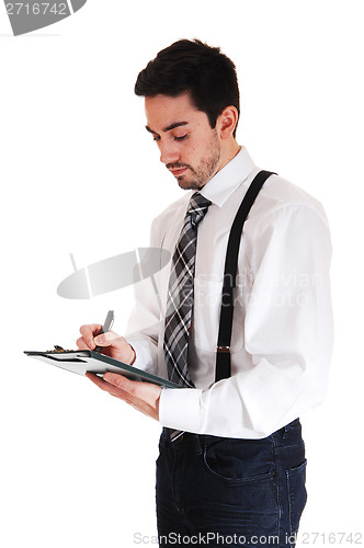 Image of Man writing on clipboard.