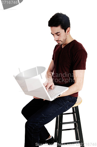 Image of Man with white laptop.