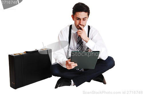 Image of Businessman sitting on floor.