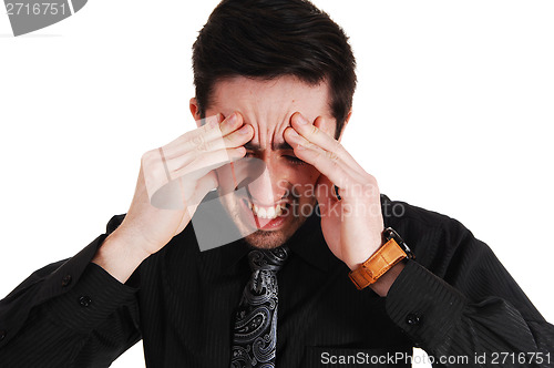 Image of Man with heavy headache.