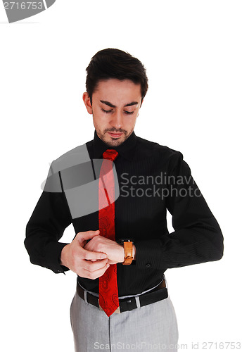 Image of Young man looking on watch.