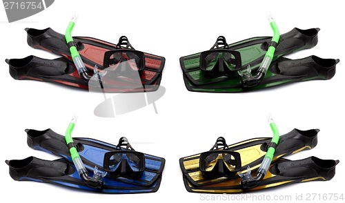 Image of Set of multicolored flippers, mask and snorkel with water drops