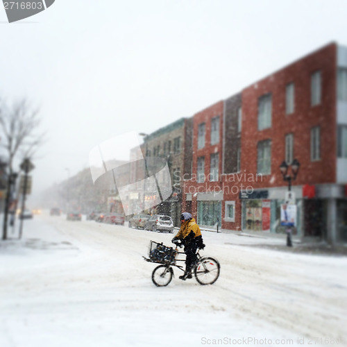 Image of Montreal, Quebec, Canada – March 12, 2014: Cyclist is riding i