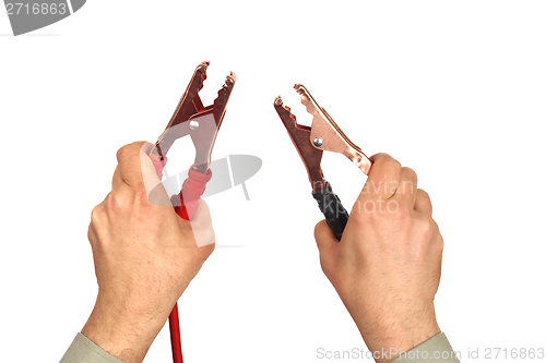 Image of Hands with jumper cables on white