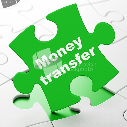 Image of Business concept: Money Transfer on puzzle background