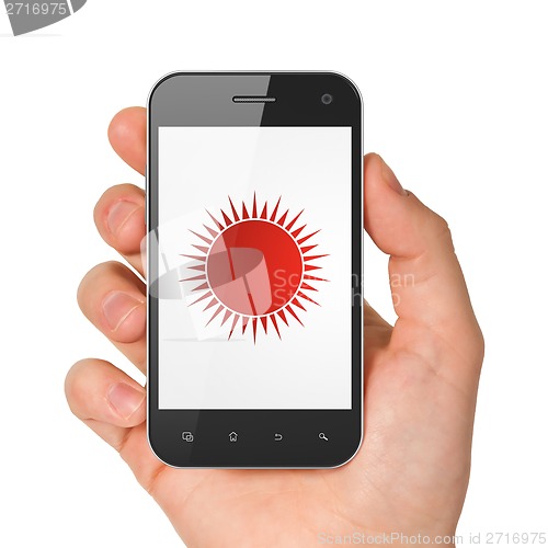 Image of Vacation concept: Sun on smartphone