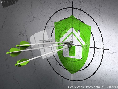 Image of Business concept: arrows in Shield target on wall background