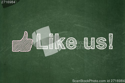 Image of Social network concept: Thumb Up and Like us! on chalkboard background