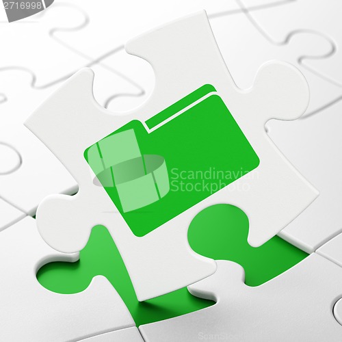 Image of Business concept: Folder on puzzle background