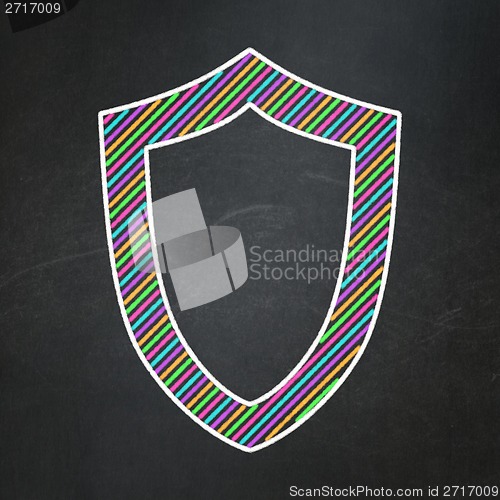 Image of Safety concept: Contoured Shield on chalkboard background